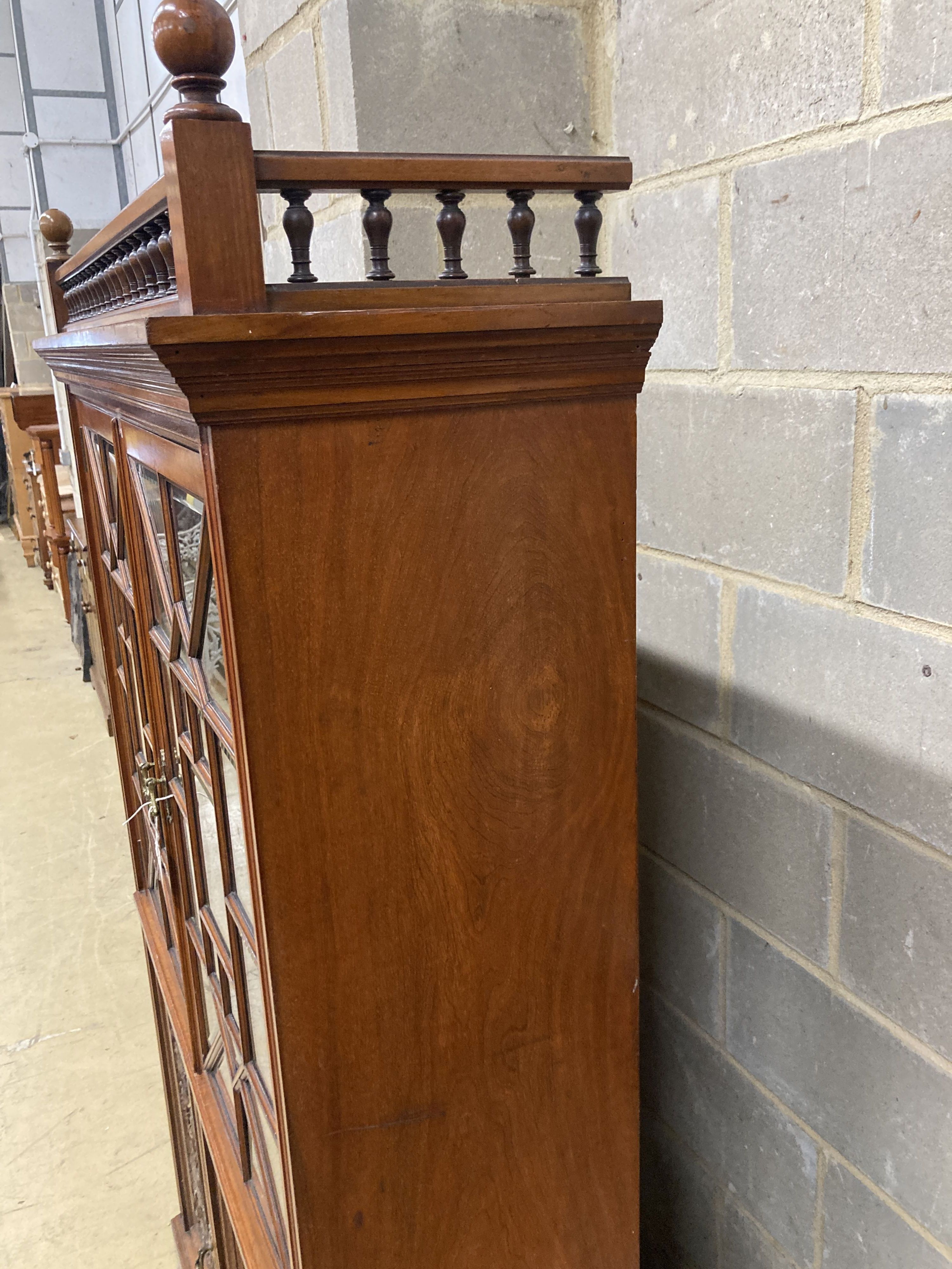 A Victorian walnut glazed bookcase cabinet, width 113cm, depth 33cm, height 184cm